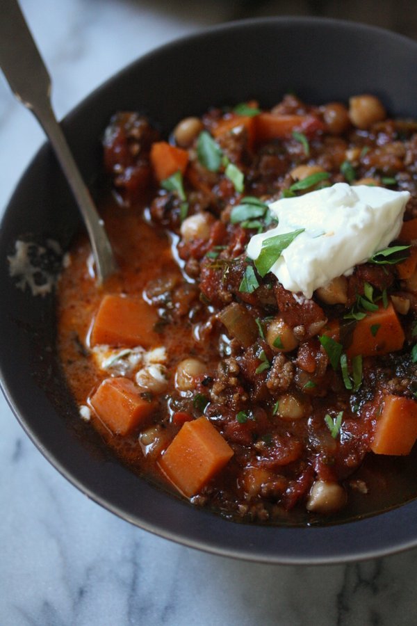 Gluten-Free Chili Recipe with Ground Lamb and Moroccan spices. Healthy with Greek yogurt instead of sour cream and lots of kale and sweet potatoes!