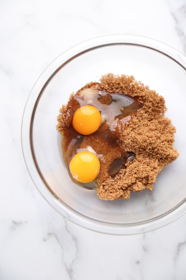 eggs and brown sugar in a bowl for flourless peanut butter cookies