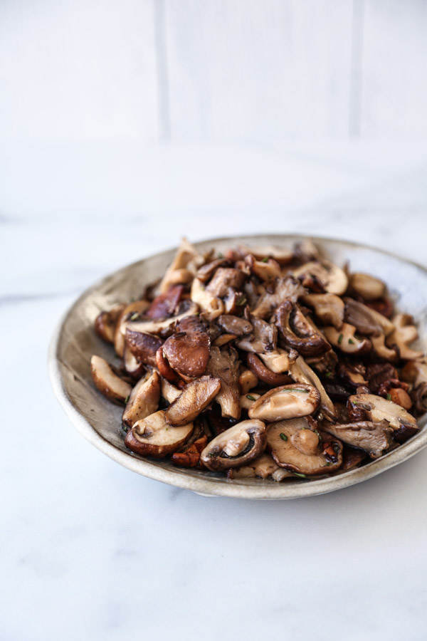 wild mushrooms in a bowl; cremini mushrooms, chanterelle, oyster mushrooms, maitaki mushrooms