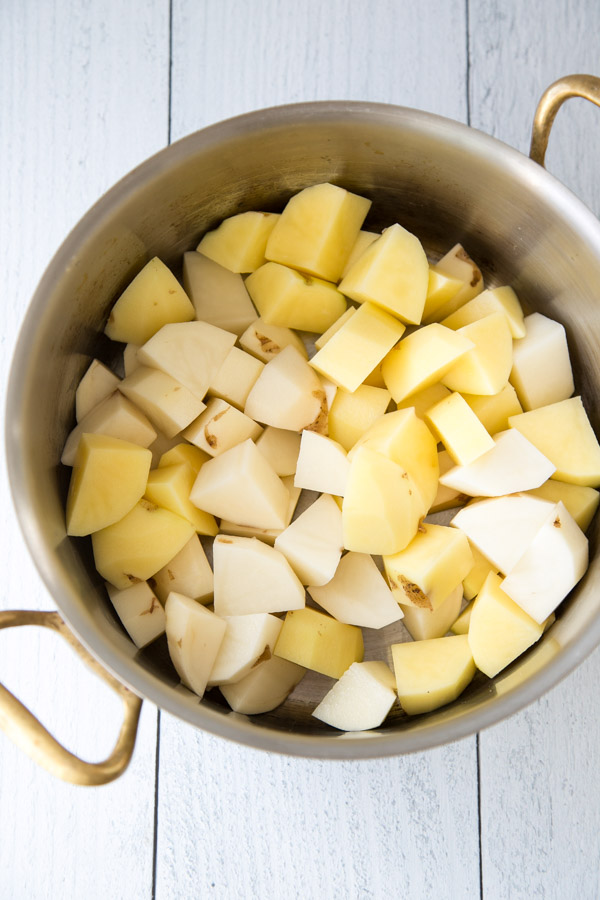 peeled potatoes in a saucepan