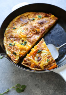 serving slice of frittata from the pan