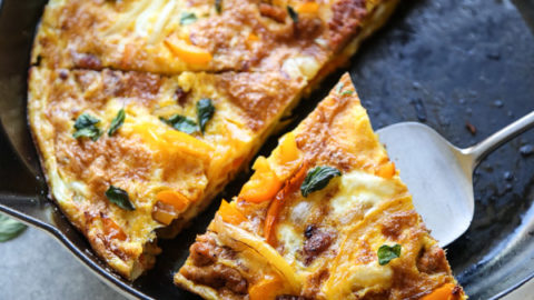 serving slice of frittata from the pan