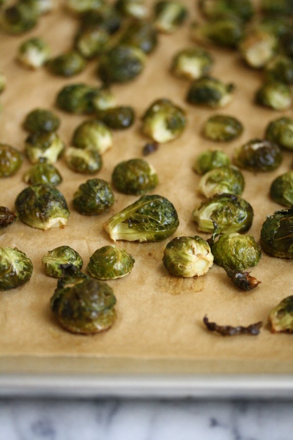 crispy browned brussels sprouts oven roasted to perfection - about to be tossed with bacon and egg mimosa