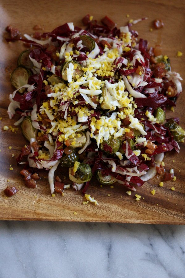 Roasted Brussels Sprout Salad with Radicchio, Egg Mimosa, and Bacon Vinaigrette 