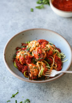 gluten-free chicken meatballs recipe in a bowl with fork