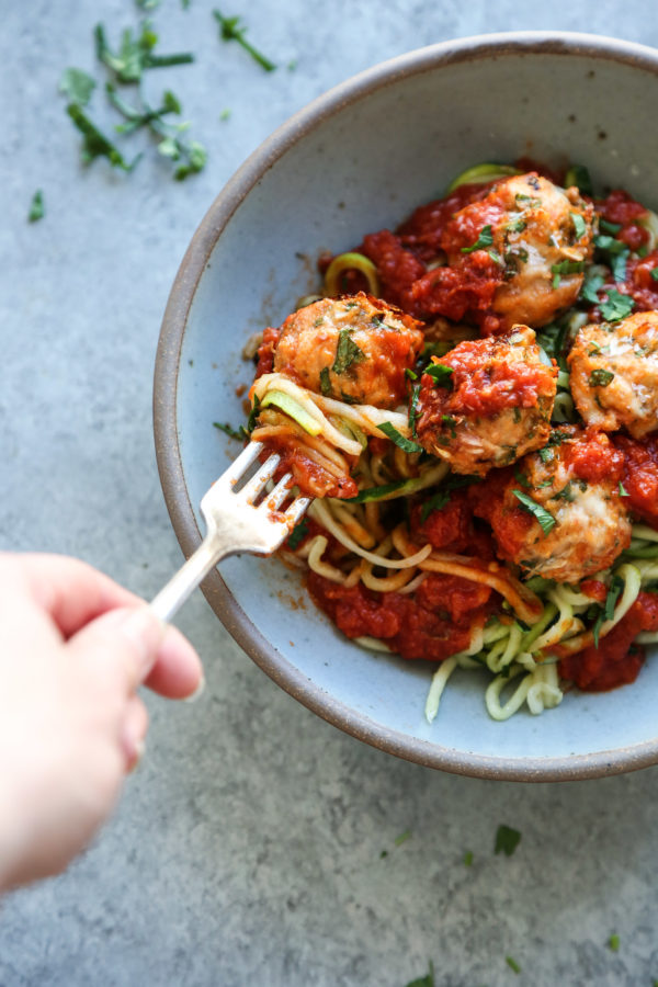 gluten-free chicken meatballs recipe in a bowl with fork