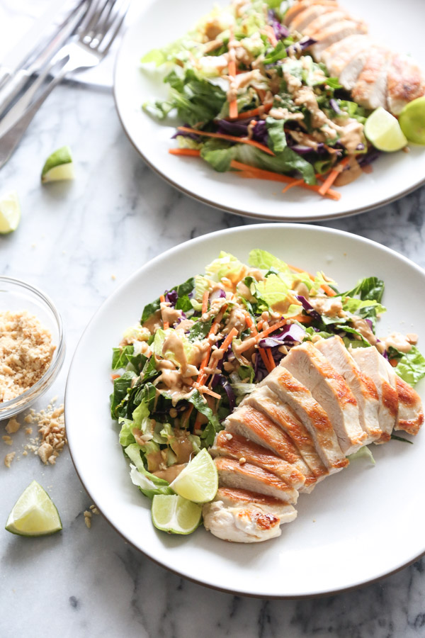 This Easy Asian Chicken Salad Recipe combines carrots, cabbage + romaine with creamy peanut dressing - a crunchy, healthy version of Chinese chicken salad! | www.feedmephoebe.com