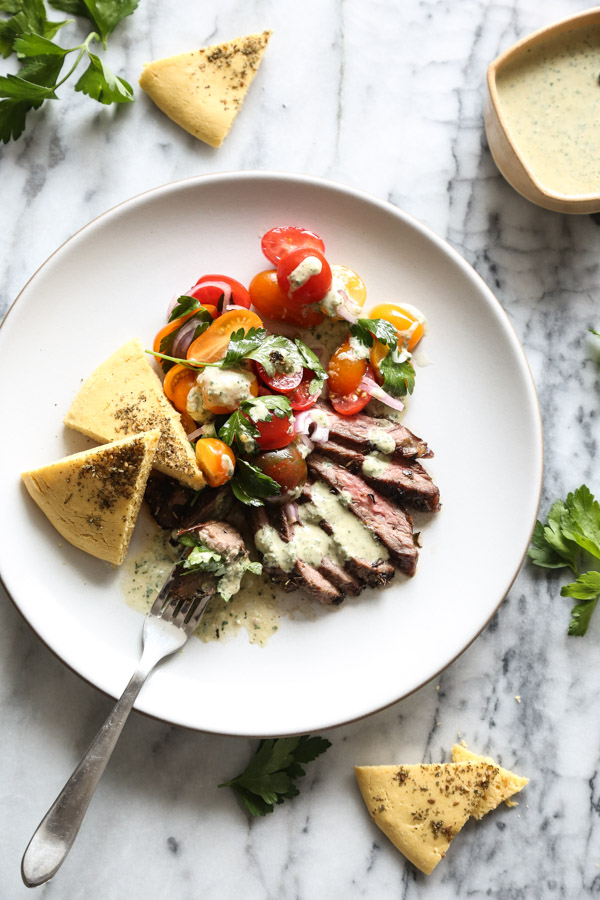 Homemade Herb Marinated Steak Gyros Plates with Tomato-Onion Salad, Gluten-Free Pitas, and Green Tahini-Yogurt Sauce | Get the healthy recipe on www.feedmephoebe.com