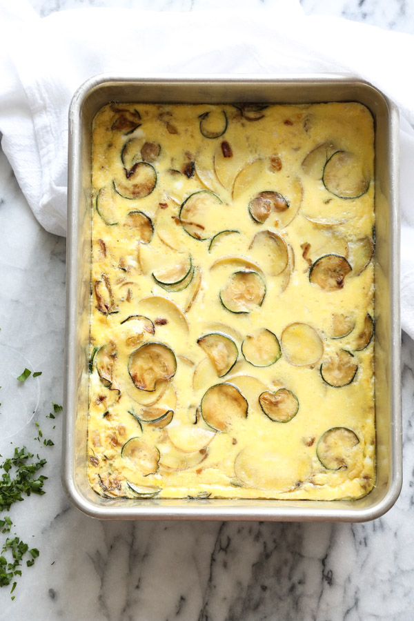 This easy tortilla espanola recipe is baked in the oven - no pan necessary. Potato is combined with zucchini for a healthy version of the Spanish omelet, and served with lemon-paprika aioli | feedmephoebe.com