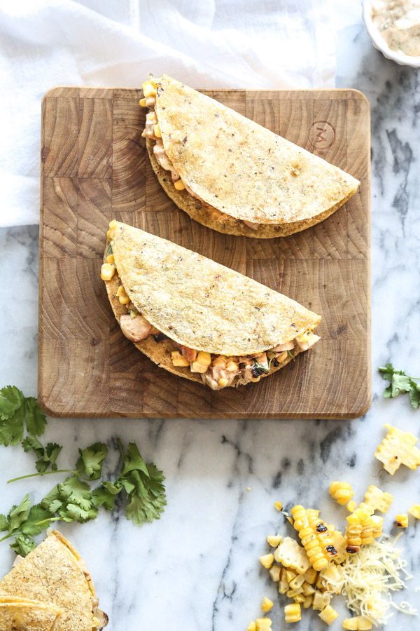 This easy chicken quesadilla recipe is grilled "elote" style, like traditional Mexican street corn. It's a great option for your summer grill! | www.feedmephoebe.com
