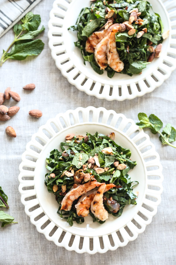 This collard green salad recipe is given a Vietnamese twist with loads of lime juice, fish sauce, fresh mint, toasted almonds and grilled shrimp - a complete healthy meal, and perfect for summer | www.feedmephoebe.com 