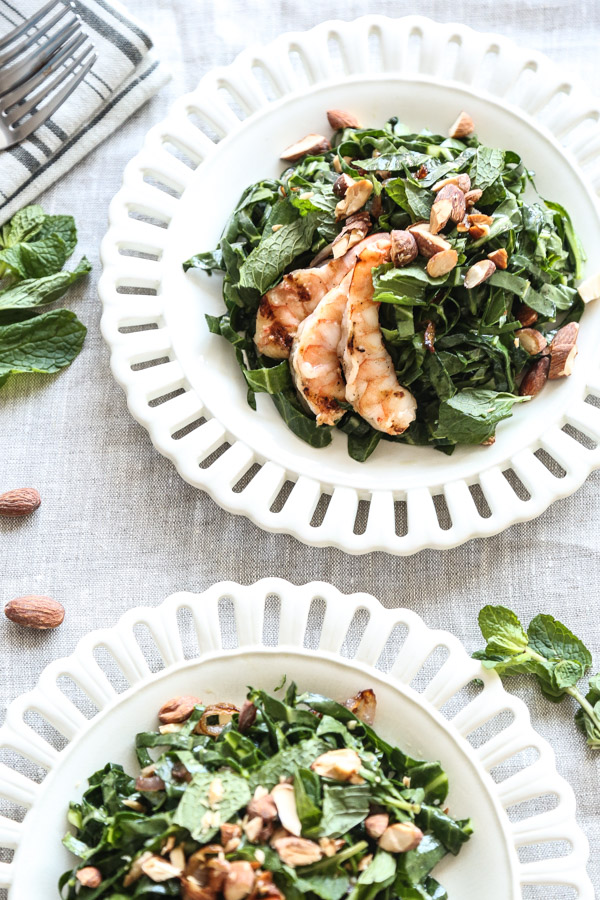 This collard green salad recipe is given a Vietnamese twist with loads of lime juice, fish sauce, fresh mint, toasted almonds and grilled shrimp - a complete healthy meal, and perfect for summer | www.feedmephoebe.com