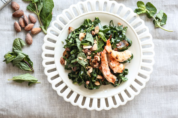 This collard green salad recipe is given a Vietnamese twist with loads of lime juice, fish sauce, fresh mint, toasted almonds and grilled shrimp - a complete healthy meal, and perfect for summer | www.feedmephoebe.com 