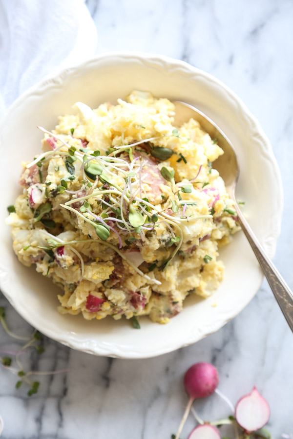 This is truly the best easy red potato salad recipe. Packed with mustard, capers, chives and (secret ingredient!) radishes--it's creamy while still being healthy, and so simple to make. Perfect for a summer BBQ | Feed Me Phoebe