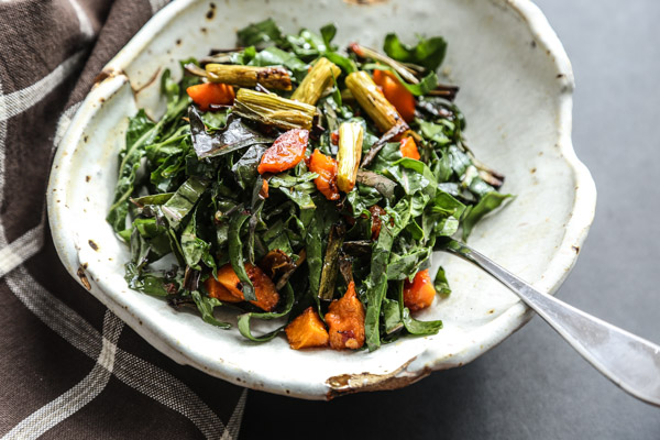 This massaged kale salad recipe is tossed with roasted butternut squash, crispy scallions and a sweet chili dressing. The perfect fall side dish! 