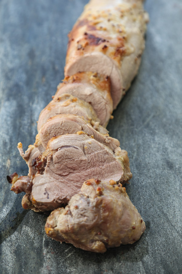 This easy roasted pork tenderloin recipe uses just a sheet pan! It's marinated in mustard sauce and baked in the oven with a healthy mix of butternut squash, black-eyed peas and leeks. | Gluten-Free | Feed Me Phoebe