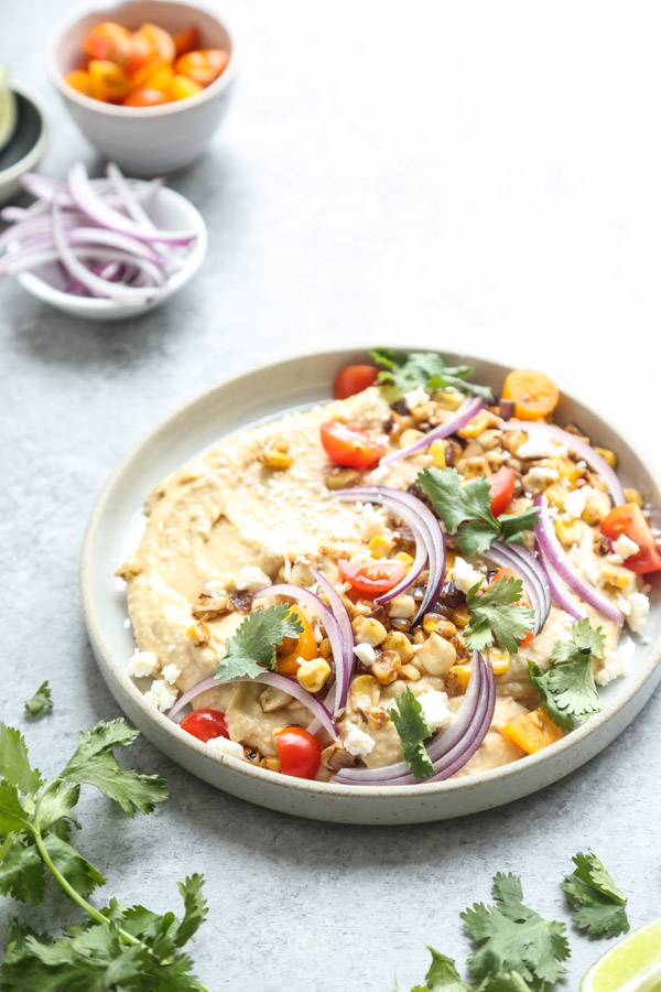 Loaded Southwestern-Style Spicy Hummus with Corn, Cherry Tomatoes, Cilantro and Red Onions | Feed Me Phoebe