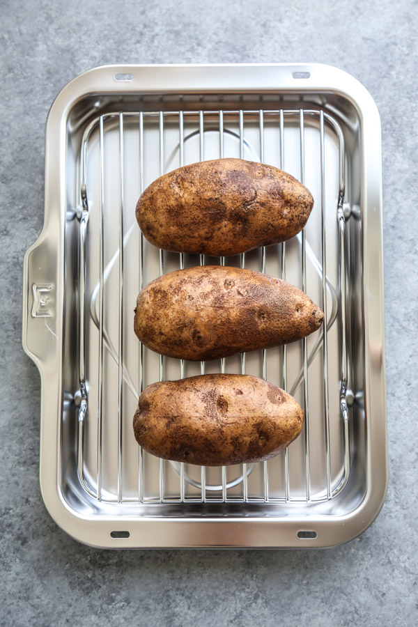 potatoes on a rack and baking dish