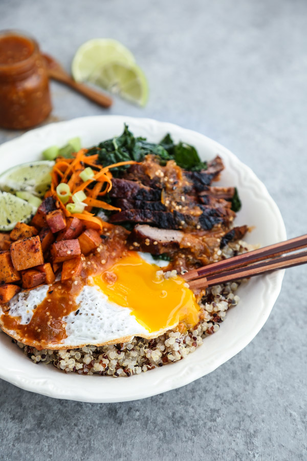 Korean Beef Bibimbap Bowl Recipe with Quinoa, Miso Sweet Potatoes and Gluten-Free Spicy Tomatillo Sauce | This Korean beef bibimbap bowl recipe is packed with healthy vegetables, quinoa instead of rice, and topped with a gluten-free spicy tomatillo sauce. 