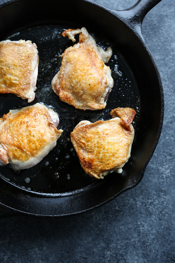 Crispy chicken thighs in a cast iron skillet