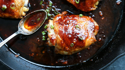 crispy saucy chicken in a cast iron skillet