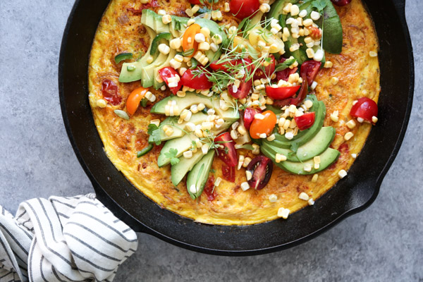 Mexican Frittata with Avocado, Corn and Tomatoes in a Skillet