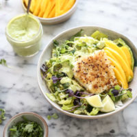 fish tacos in bowls with slaw and mango