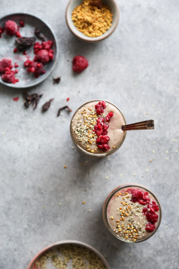 raspberry smoothie with bee pollen and hibiscus in a glass