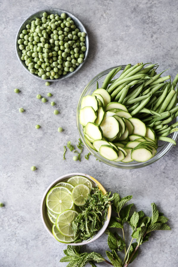 summer veggies in bowls. zucchini peas string beans