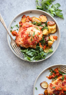 peri peri chicken plated with salad and potatoes