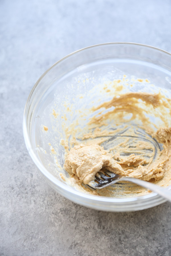 tahini paste in a bowl with fork