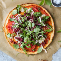 gluten-free salad pizza pie on a board