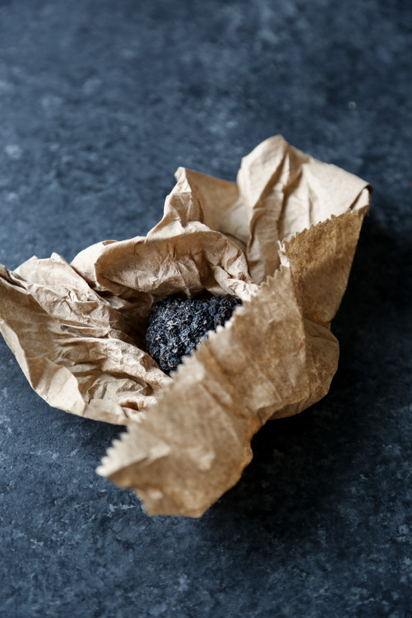 black summer truffle in a brown paper 