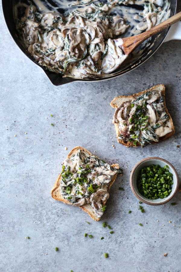 pan of creamy mushrooms and toast