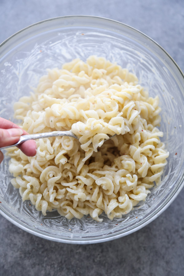 pasta carbonara sauce in a bowl with fusilli 