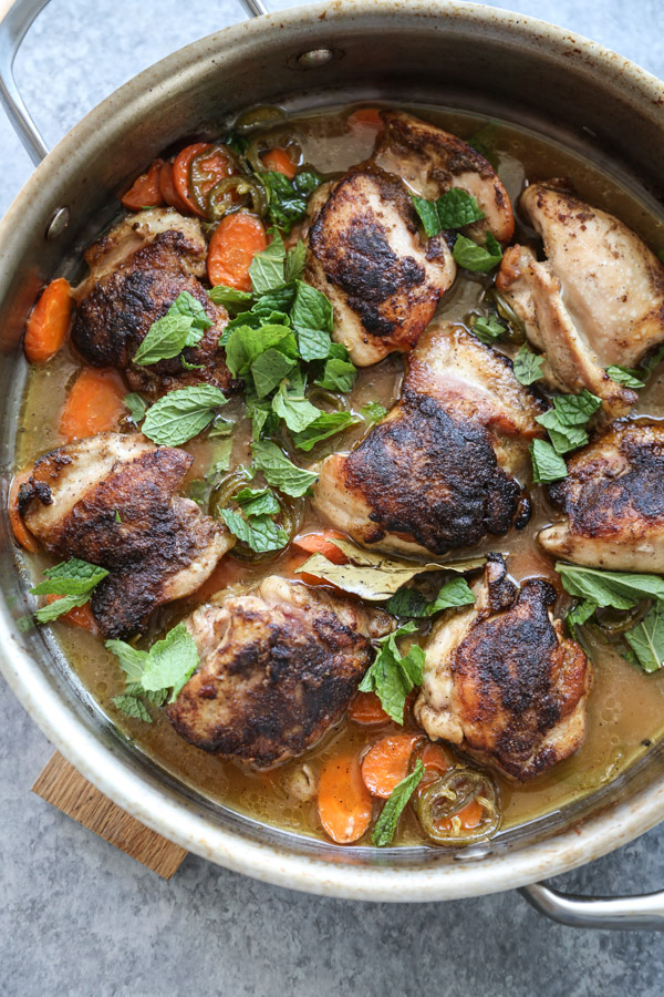 Low fodmap chicken thighs in a pan with jalapenos and carrots