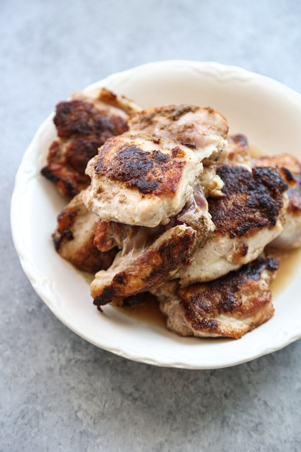 Charred low fodmap chicken thighs in a bowl