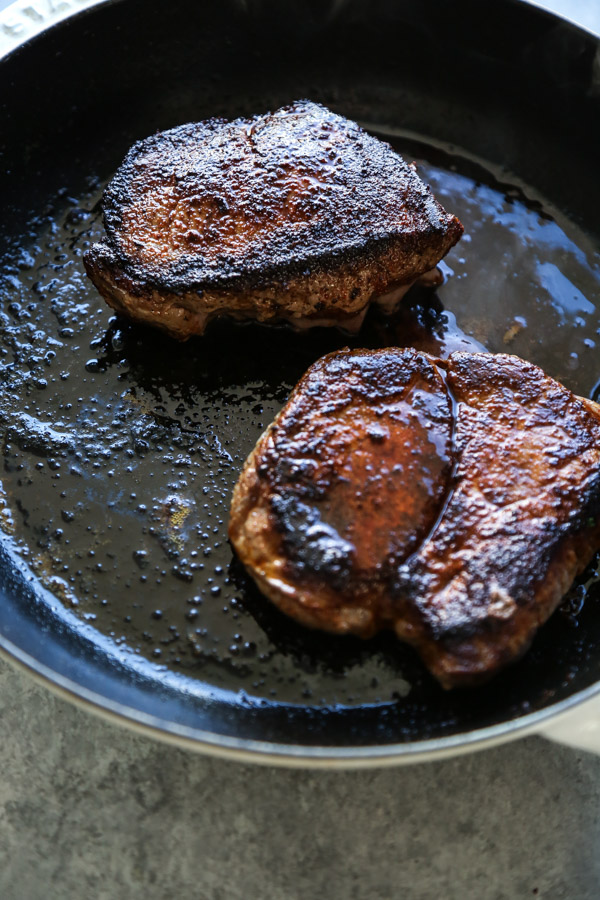 steared steak in a cast iron skillet oven