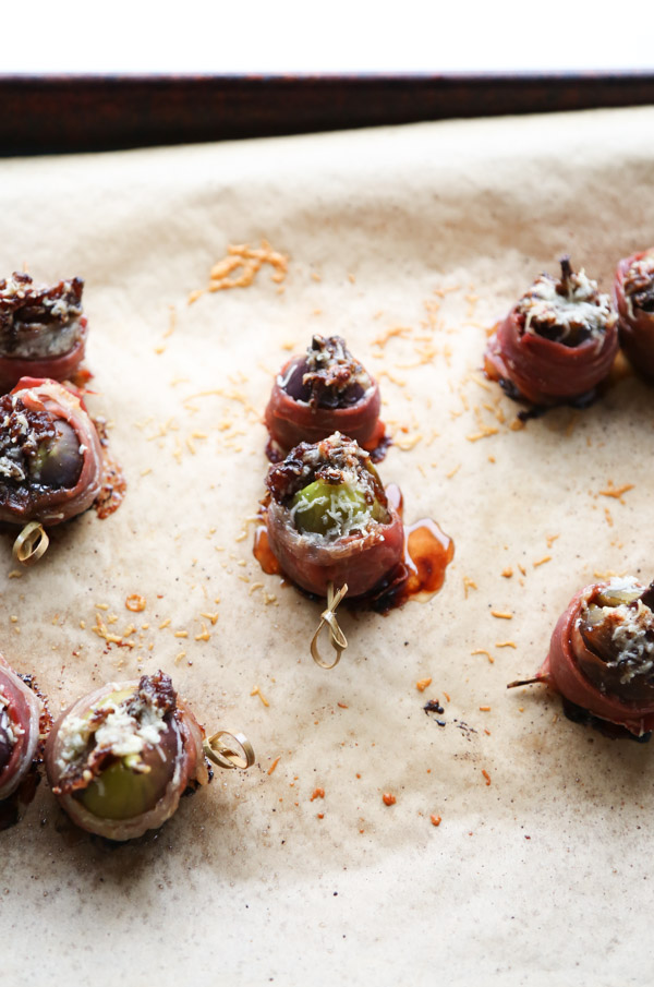 prosciutto wrapped figs on a sheet pan