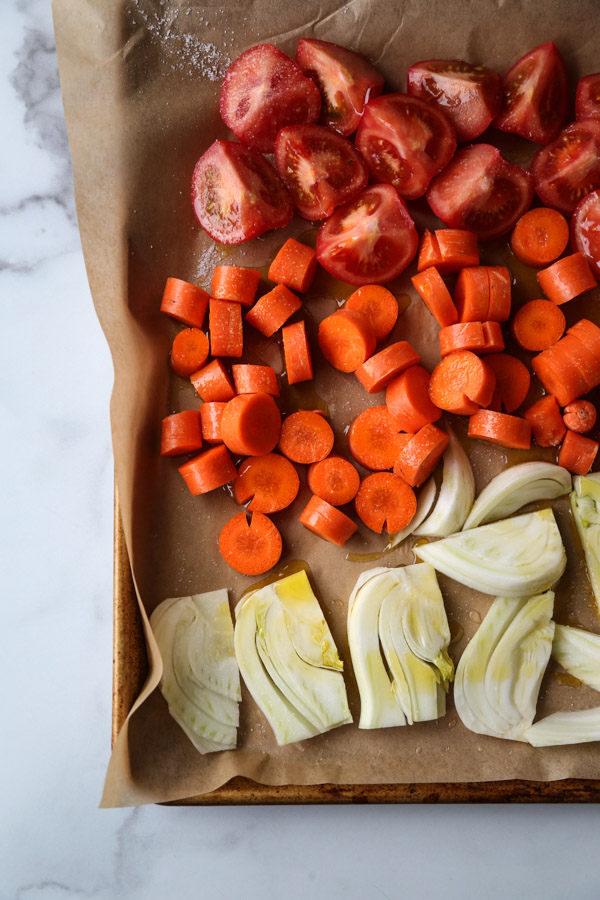tomatoes carrots and fennel on a sheet pan