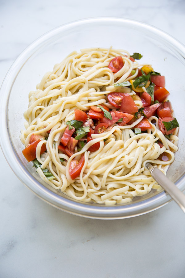 gluten-free linguine in a bowl with tomatoes