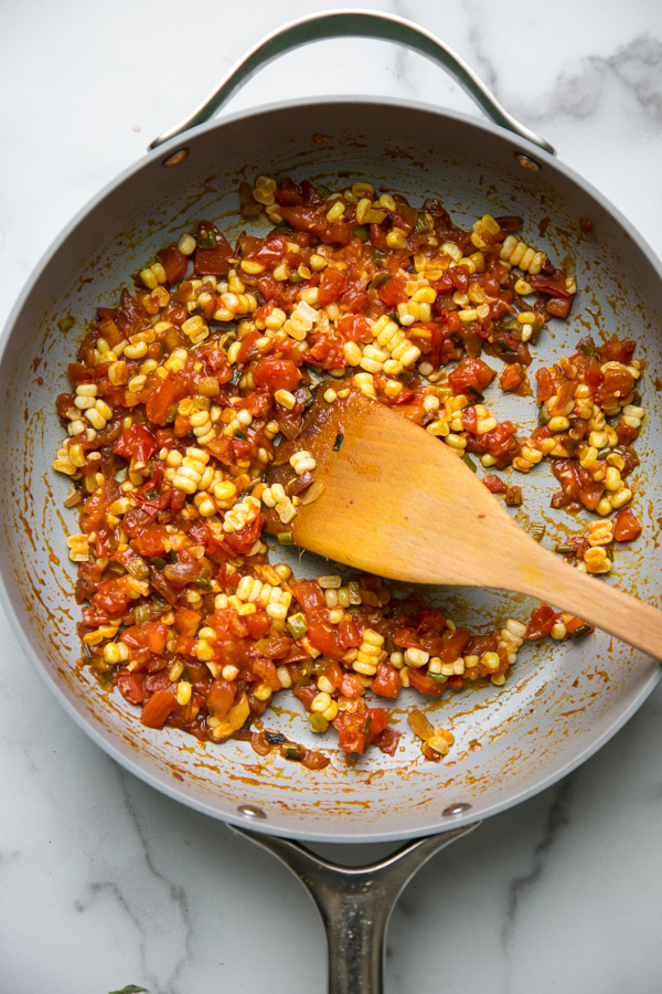 succotash in a pan with a spatula