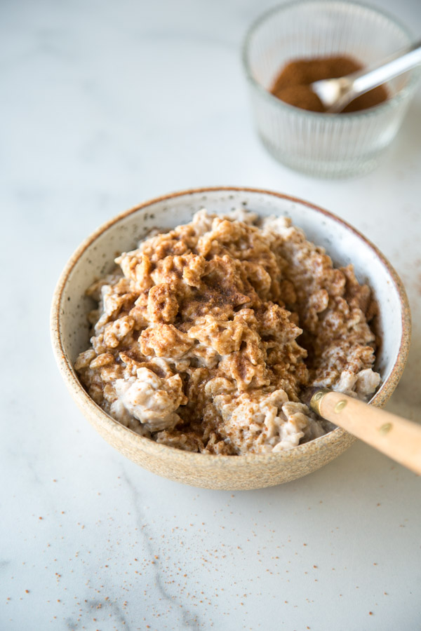 The Best 15-Minute Low FODMAP Oatmeal Recipe - creamy oatmeal in a bowl with cinnamon and coconut sugar on top | Feed Me Phoebe