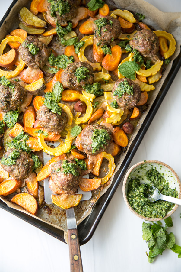low fodmap sheet pan dinner with a spatula and salsa verde on the side