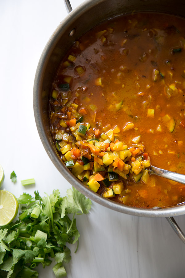 Summer Detox Soup in a pot with zucchini, summer squash and peppers