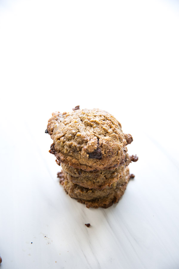 stacked baked baked steel cut oat cookies on marble