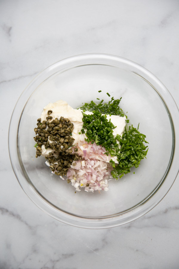 mixing bowl with cream cheese, mayo, capers, chives, shallots and parsley