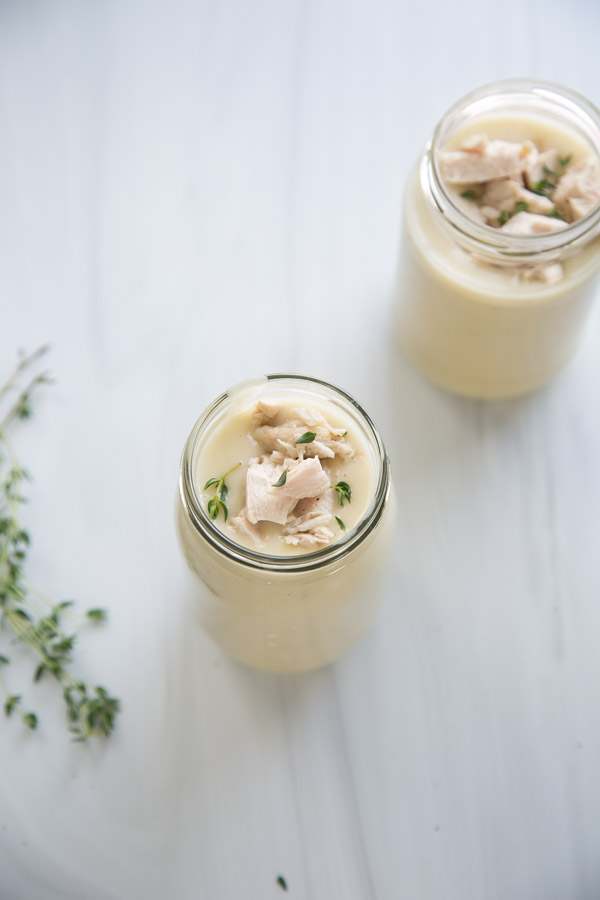 two jars of gluten-free cream of chicken soup and thyme sprigs