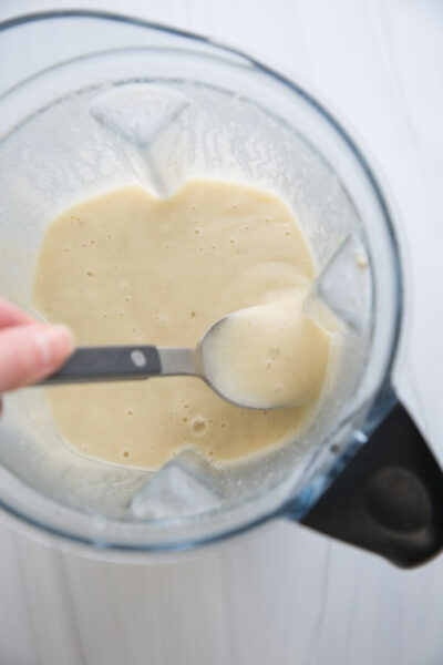blender full of gluten-free cream of chicken soup with spoon