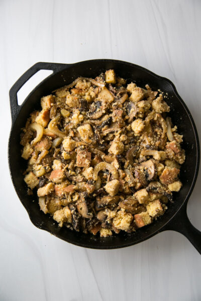 gluten-free cornbread dressing mixture in a skillet before the oven